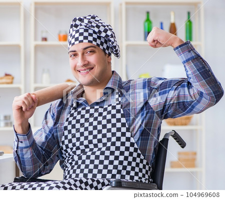 Young cook with roller preparing dough meal Young cook with roller preparing dough meal 104969608