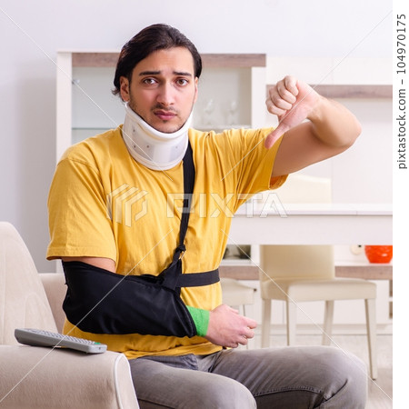 Young man after car accident suffering at home 104970175