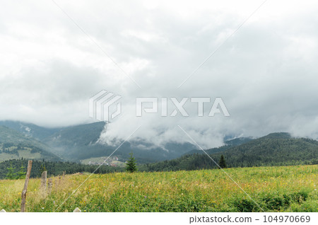 Green Ukrainian mountains. Summer time. Beautiful views of the largest peaks. 104970669