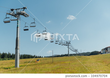 View from the lift to the Carpathian mountains. Tourists move looking at the landscapes 104970704
