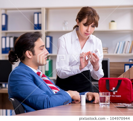 Young employee suffering in the office Young employee suffering in the office 104970944