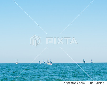 Sailing boat yacht or sailboat group regatta race on sea or ocean water. Sailing boat yacht or sailboat group regatta race on sea or ocean water. 104970954