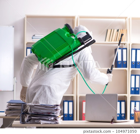 Professional contractor doing pest control at office Professional contractor doing pest control at office 104971050