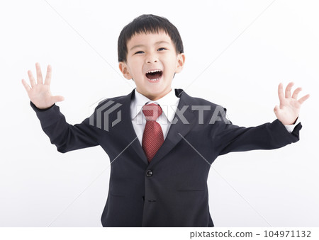 Happy Boy in a suit isolated on white background Happy Boy in a suit isolated on white background 104971132