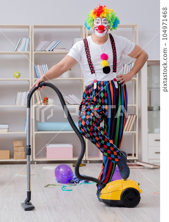 Funny clown doing cleaning at home Funny clown doing cleaning at home 104971468