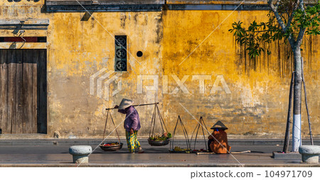 Street hawkers in Hoi An, Vietnam Street hawkers in Hoi An, Vietnam 104971709