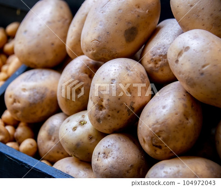Potatoes at the market display Potatoes at the market display 104972043