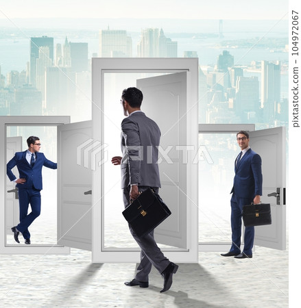 Businessman in uncertainty concept with many doors Businessman in uncertainty concept with many doors 104972067