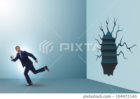 Businessman breaking through the wall 104972140