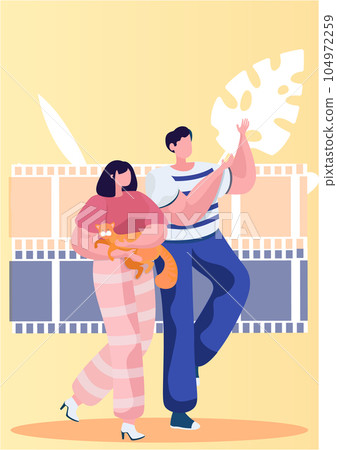 Couple walking with cat holding it. Man and woman strolling down the street in good summer weather 104972259