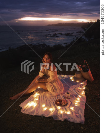 Romantic Dinner for Two Near Sea During Sunset Romantic Dinner for Two Near Sea During Sunset 104973306