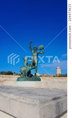 Close view of the ancient sculpture Le Dresseur d'oursons in Marseille in South France 104973615