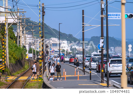 Kamakura Cityscape in Japan Pilgrimage boom again, Kamakura High School Mae No. 1 railroad crossing and busy seaside roads crowded with tourists visiting Japan Kamakura Cityscape in Japan Pilgrimage boom again, Kamakura High School Mae No. 1 railroad crossing and busy seaside roads crowded with tourists visiting Japan 104974481