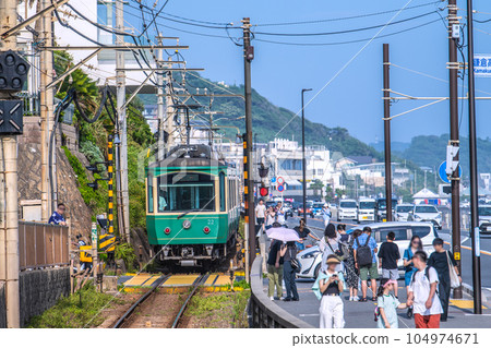 Kamakura cityscape in Japan Pilgrimage boom again, Enoden / Kamakura High School Mae No. 1 railroad crossing crowded with tourists visiting Japan Kamakura cityscape in Japan Pilgrimage boom again, Enoden / Kamakura High School Mae No. 1 railroad crossing crowded with tourists visiting Japan 104974671