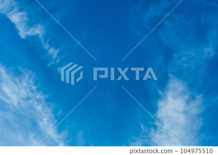 White cirrus clouds weather change wind natural background against the blue sky White cirrus clouds weather change wind natural background against the blue sky 104975510