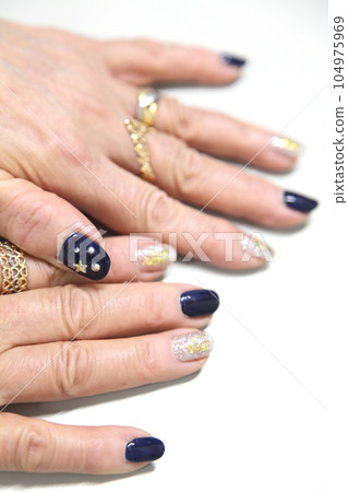 Dark blue with rhinestones and gold glitter nail deco Dark blue with rhinestones and gold glitter nail deco 104975969