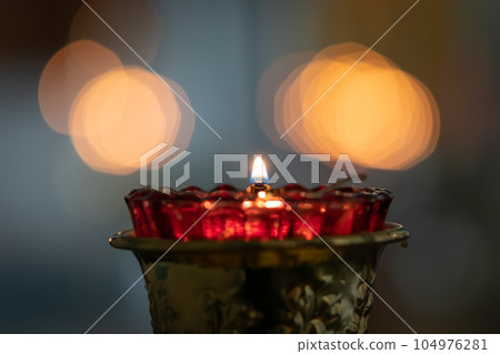 Burning candles in a Christian Orthodox church. Burning candles in a Christian Orthodox church. 104976281