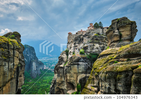 Monastery of Varlaam in famous greek tourist destination Meteora in Greece on sunset with scenic scenery landscape 104976343