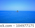 Blue sea and fishing boats 104977175