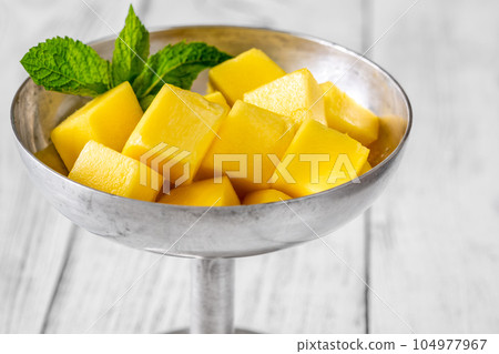 Fresh mango cubes Fresh mango cubes 104977967