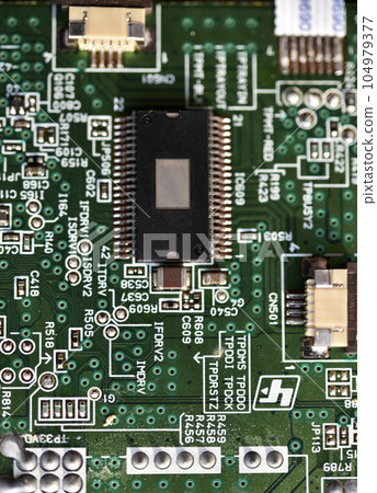 Blue board with radio elements. A chip with a processor and transistors. Diodes and resistors. Microchip. 104979377