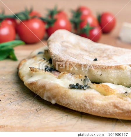 Closed calzone pizza Closed calzone pizza 104980557