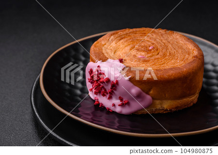 Round puff pastry croissant with raspberry filling or new york roll Round puff pastry croissant with raspberry filling or new york roll 104980875