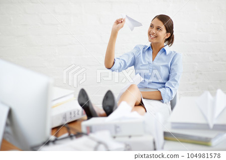 Business woman throw paper plane in office for ideas, vision and relaxing at desk with paperwork for management. Happy professional or corporate person on break, paperwork and creative inspiration Business woman throw paper plane in office for ideas, vision and relaxing at desk with paperwork for management. Happy professional or corporate person on break, paperwork and creative inspiration 104981578