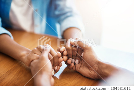 Empathy, faith and trust with friends and holding hands for comfort, kindness and gratitude. Hope, help and support with closeup of people at home for depression during cancer, praying or forgiveness 104981611