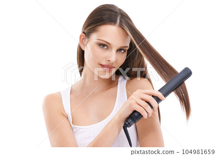 Woman with hair care, iron for hair and beauty portrait, cosmetic care and electric tools against white background. Straight hair, keratin and treatment with hairstyle mockup, wellness and grooming 104981659