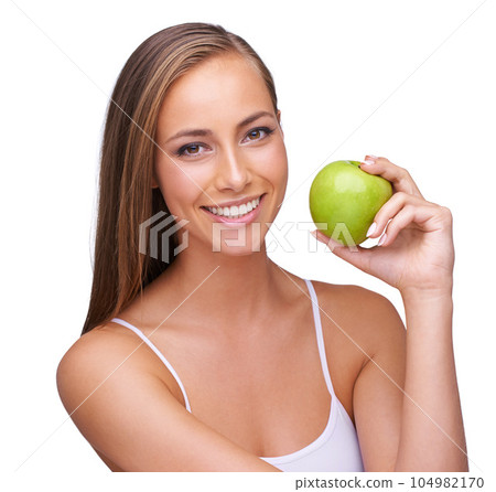 Apple, wellness and portrait of woman on a white background for healthy lifestyle, cosmetics and wellbeing. Diet, healthcare and face of girl with fruit for organic products, vitamins and nutrition Apple, wellness and portrait of woman on a white background for healthy lifestyle, cosmetics and wellbeing. Diet, healthcare and face of girl with fruit for organic products, vitamins and nutrition 104982170