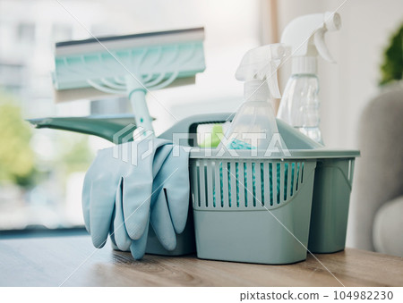 Grab your supplies and start cleaning. Shot of a basket with cleaning supplies on a table. 104982230