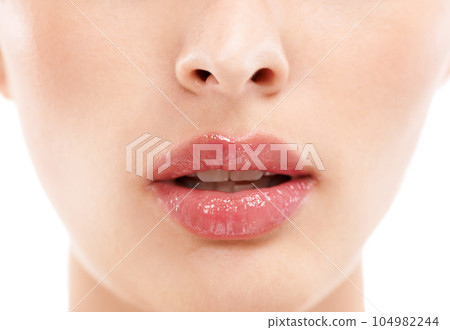 Woman face, skincare or lips with makeup cosmetics, mouth dermatology or healthcare wellness on white background. Zoom, beauty model and macro of facial lip gloss product for collagen hydration glow 104982244