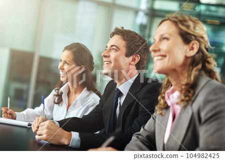 Business, people and presentation with training for learning and a discussion about a collaboration. Group, professional and conference with a smile are planning for teamwork in a business meeting. 104982425