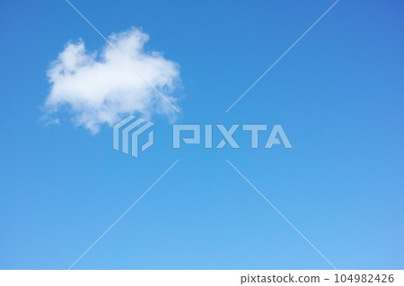 Copy space with cumulus clouds in a clear blue sky from below. Beautiful panoramic of fluffy white cloudscape background for cool climate and season of sunny weather in the atmosphere outdoors 104982426