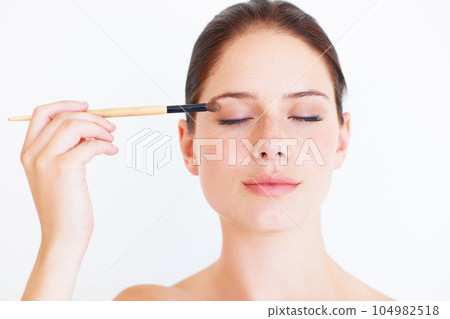 Makeup brush, face beauty or studio woman relax with cosmetics product, facial skincare glow or eyeshadow application. Natural care, spa salon or aesthetic model girl isolated on white background 104982518