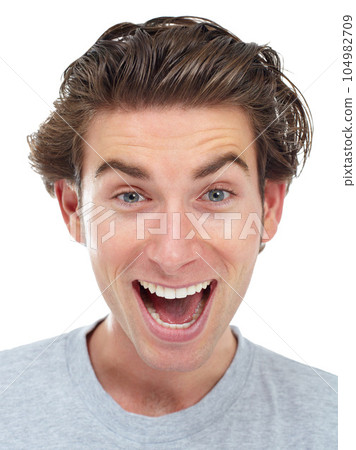 Excited, face and man portrait in a studio with happiness from deal and announcement with smile. Isolated, white background and male person face shouting from good news, winning and surprise Excited, face and man portrait in a studio with happiness from deal and announcement with smile. Isolated, white background and male person face shouting from good news, winning and surprise 104982709