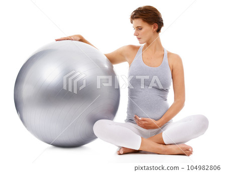 Pregnant, woman and fitness ball with white background for exercise, pilates and wellness. Pregnancy, medicine ball and mother workout on studio background for healthy body, yoga training and energy 104982806