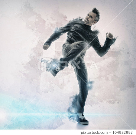 Fashion, art and man dance in studio for freedom, celebration or expression on mockup space. Creative, funky and male dancer in cool outfit with passion, hip hop or funky aesthetic on wall background 104982992