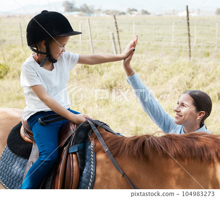 My favourite learner. young girl with her instructor with a horse outdoors in a forest. 104983273