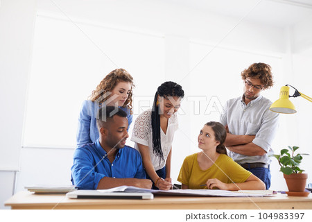 Diversity, business people and writing in team project, planning or strategy together at office. Group of diverse employees working on paperwork, documents or teamwork for brainstorming at workplace 104983397
