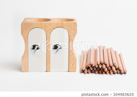 Keep it sharp, make your mark. Studio shot of a wooden sharpener and pencils. 104983620