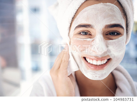 Skincare, facial and portrait of woman in a bathroom for cleaning, beauty and grooming closeup in her home. Face, girl and skin product mask for exfoliate, scrub and hygiene, routine and wellness 104983731