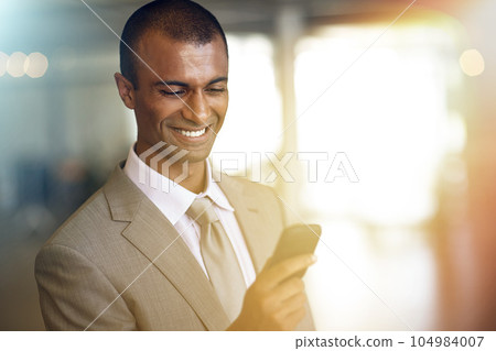 Phone, reading and business man smile for communication, networking with client or social media in legal career. Cellphone, typing or online search of corporate indian person or lawyer in light leak 104984007