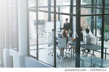 Speaker, leadership or business people in presentation for sales report, vision or data analysis in mentorship. Teaching, group or manager planning strategy on screen monitor in training or meeting 104984214