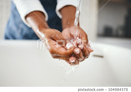 Woman cleaning hands, water and hygiene in bathroom, safety from bacteria and germs, disinfection and skincare. Health, wellness and female person at home, sustainability and healthy with handwashing Woman cleaning hands, water and hygiene in bathroom, safety from bacteria and germs, disinfection and skincare. Health, wellness and female person at home, sustainability and healthy with handwashing 104984378