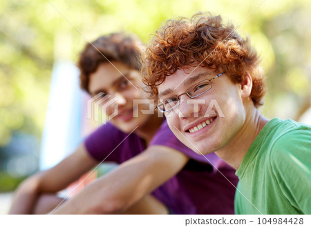 Portrait, children and friends in a park together during summer for bonding outdoor on holiday. Friendship, kids or boys with a young child and best friend outside in the day on a blurred background 104984428