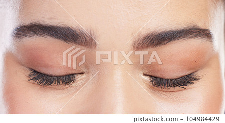 Eyeshadow, eyes closed and woman with mascara eyelash extension, makeup results or natural face cosmetics. Anti aging skincare, wellness and closeup beauty person with thick lashes, peace and relax 104984429