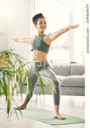 Arms, stretching and happy woman with yoga warrior pose in living room for balance, mental health or wellness at home. Body, stretch and lady smile for pilates, fitness or flexible training workout Arms, stretching and happy woman with yoga warrior pose in living room for balance, mental health or wellness at home. Body, stretch and lady smile for pilates, fitness or flexible training workout 104984474
