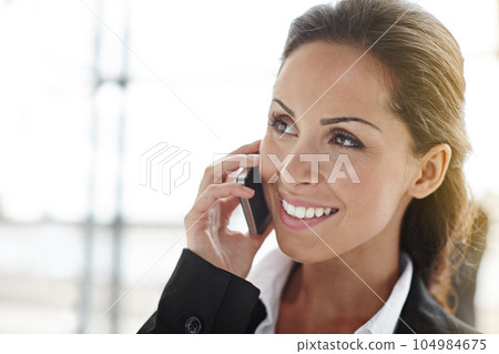 Business woman, phone call and thinking in office lobby for online networking, happy communication and news feedback. Ideas, smile and solution of corporate person or employee talking on mobile chat Business woman, phone call and thinking in office lobby for online networking, happy communication and news feedback. Ideas, smile and solution of corporate person or employee talking on mobile chat 104984675
